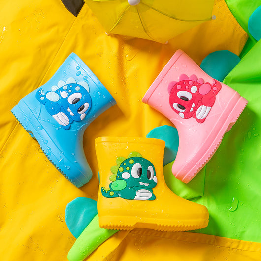 Bright yellow children's rain boots with a green cartoon dinosaur appliqué, designed for waterproof outdoor play. - Image 4