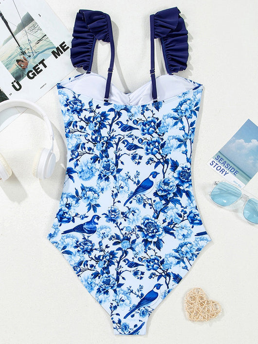 Women's blue and white floral one-piece swimsuit with ruffled straps and a front keyhole tie detail. - Image 9