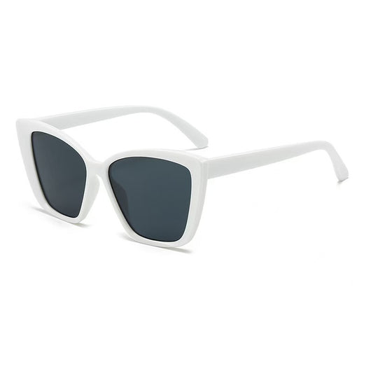 Clear large-frame square glasses held by a hand in a grey knitted sweater, showcasing the transparent plastic frame. - Image 17