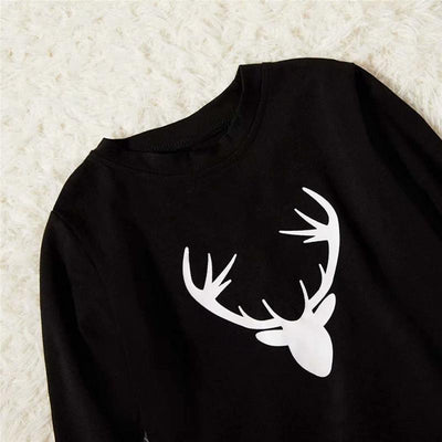 Mom's black long-sleeve pajama top with white deer head print and red and black plaid pajama pants. - Image 11