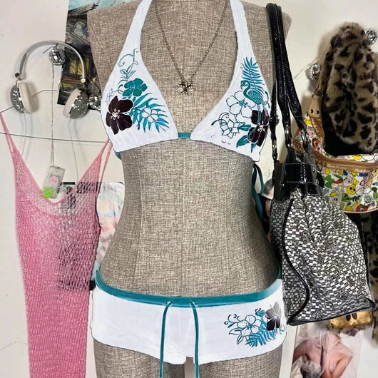 Black halter bikini suit with boy short bottoms, featuring pink and blue floral and flamingo patterns. - Image 7