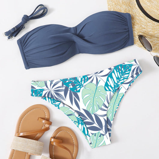 Blue bandeau bikini top with tropical leaf print high-cut bottom, styled with sandals, sunglasses, and a straw hat. - Image 8