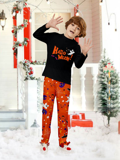 Family of four wearing matching black and orange Halloween long-sleeve pajamas with ghost and bat prints. - Image 15