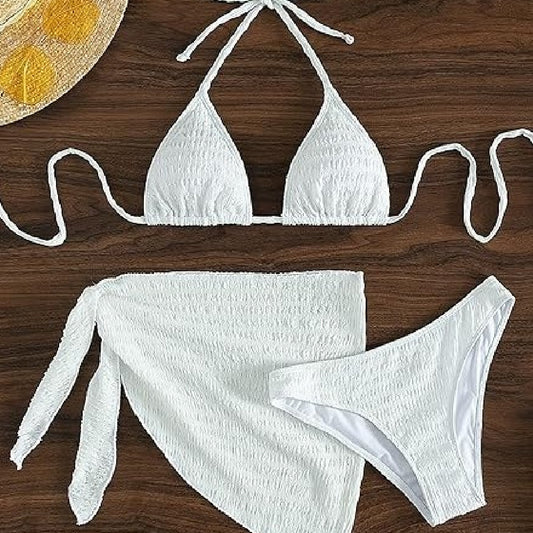 White textured lace-up split bikini swimsuit with a triangle halter top, high-cut bottoms, and matching sarong.