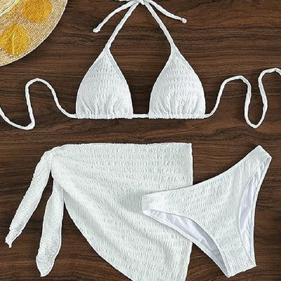 White textured lace-up split bikini swimsuit with a triangle halter top, high-cut bottoms, and matching sarong.