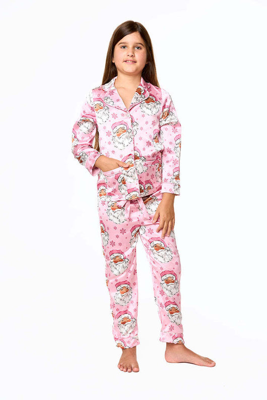 Young girl in a leopard print pajama set with black feather trim on the cuffs and ankles, wearing a pink glitter headband. - Image 19
