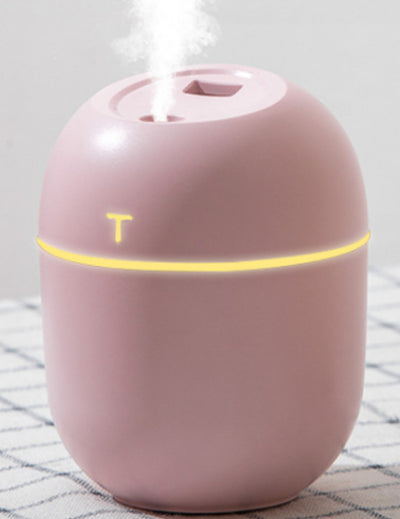 White egg-shaped mini USB humidifier with a 220ml capacity, featuring a subtle 'T' logo and grey accent line. - Image 2