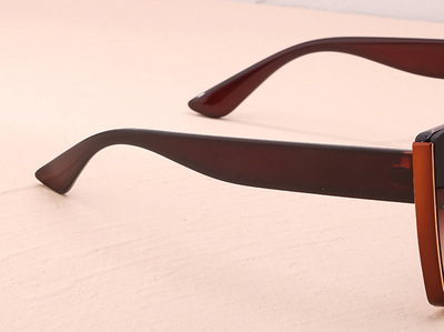 Women's black cat-eye sunglasses with large frames, gradient gray lenses, and gold-tone accents. - Image 22