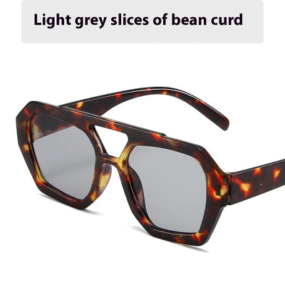 Minimalist square fashion sunglasses with a tortoiseshell frame and light brown lenses, angled view. - Image 6