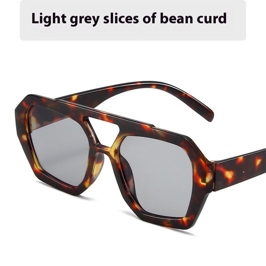 Minimalist square fashion sunglasses with a tortoiseshell frame and light brown lenses, angled view. - Image 6