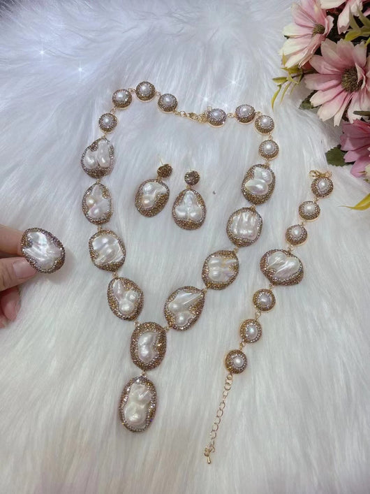 Baroque pearl necklace, ring, earrings, and bracelet set with gold-toned settings and sparkling accents. - Image 6