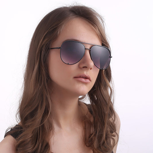 Black metal aviator sunglasses with dark grey lenses, a double bridge, and slender temples.