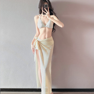 Women's light purple three-piece bikini set with a triangle halter top, bottoms, and a mesh sarong with rose details. - Image 3
