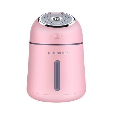 Light blue mini ultrasonic humidifier with a silver top, power button, and clear water level indicator. - Image 6