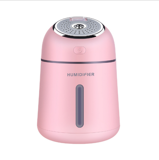 Light blue mini ultrasonic humidifier with a silver top, power button, and clear water level indicator. - Image 6