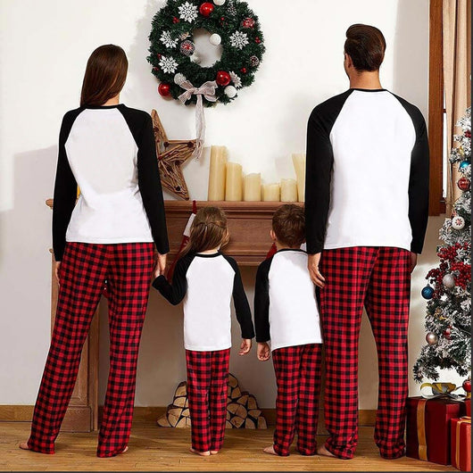 Family matching Christmas pajamas with a deer graphic and "Merry Christmas" text on white and black tops, paired with red and black buffalo plaid pants. - Image 5