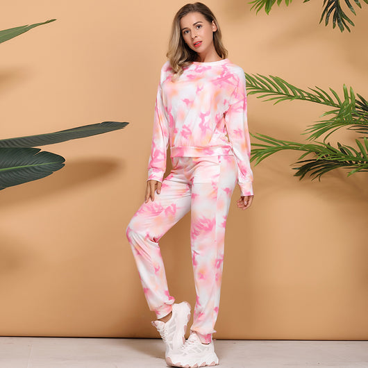 Woman wearing a pink and white tie-dye long-sleeve top and matching pants set, posing casually. - Image 12
