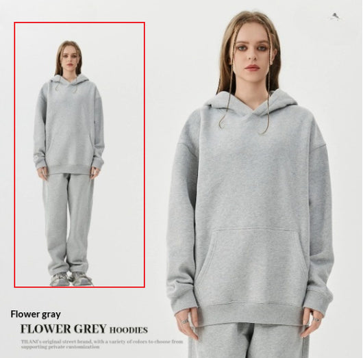 Young woman wearing a pink fleece-lined hoodie and matching sweatpants tracksuit set with a drawstring hood and kangaroo pocket. - Image 10