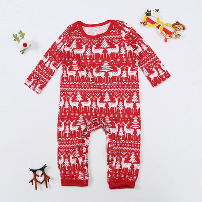 Red long-sleeve Christmas pajama set with white reindeer and Christmas tree patterns, featuring a crew neck top and patterned pants. - Image 2