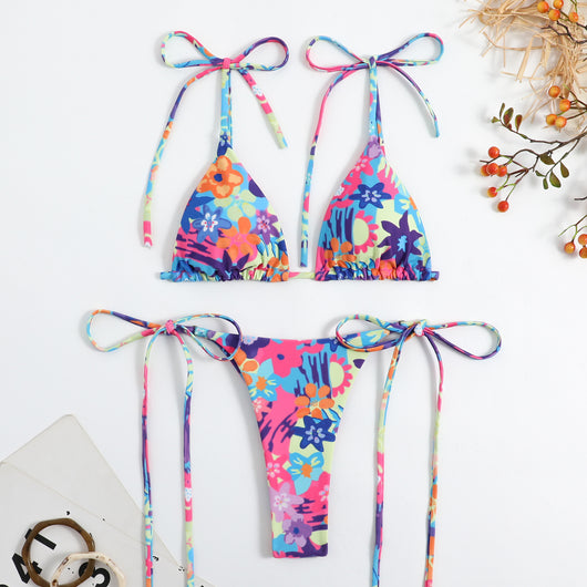 Vibrant floral print bikini set with tie-side triangle top and matching bottoms, featuring pink, blue, orange, and purple flowers. - Image 18