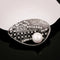 Men's white suit brooch