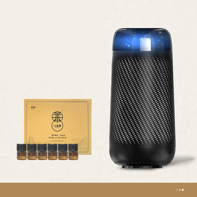 Black car aroma diffuser humidifier with blue light, wireless charging, and automatic spray, shown with six essential oil bottles. - Image 6
