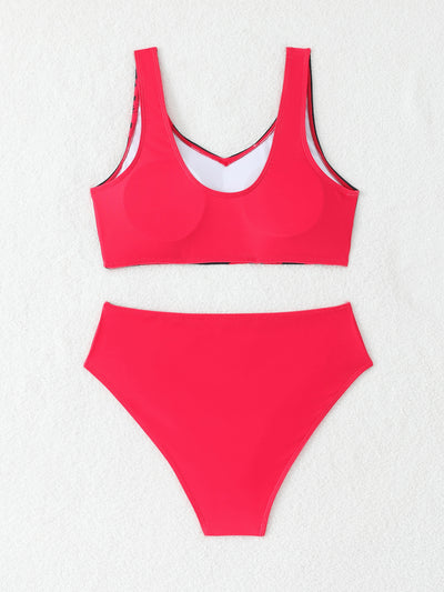 Women's two-piece swimsuit with black and purple floral print. Features a V-neck sports bra top and mid-rise bottom. - Image 38