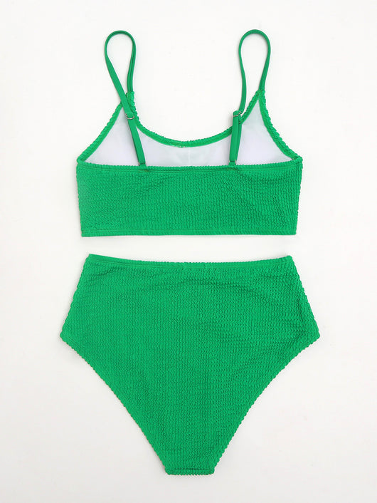 Woman in a solid green textured high-waisted bikini, holding a disposable camera on a sunny beach. - Image 11