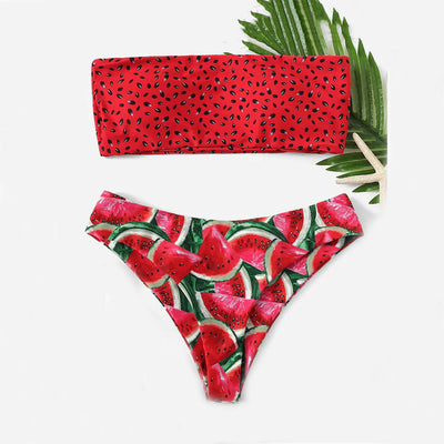 Red bandeau bikini top with black watermelon seed print and high-waisted bottoms with watermelon slice pattern.