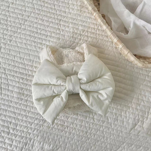 Creamy-white plush dog harness with a large decorative bow on the back, worn by a small poodle-like dog. - Image 23