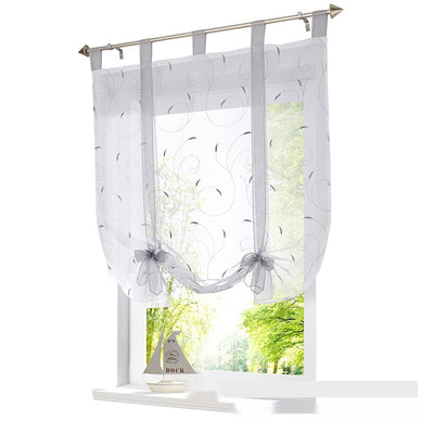 White sheer Roman window screen with red embroidered floral patterns and red ribbon ties, hanging from a silver rod. - Image 5