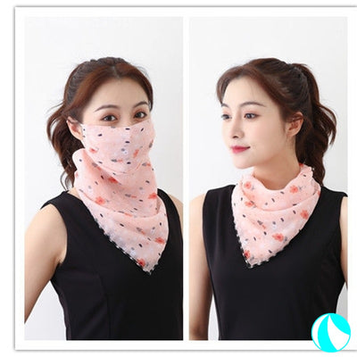 White women's UV protection scarf with black speckle pattern, worn as a face mask and neck scarf. - Image 9