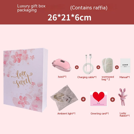 Pink stomach warming belt with vibration and heating, USB charging cable, two wormwood bags, and manual in a floral gift box. - Image 4