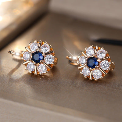 Aretes Flor de Zirconia Blanca y Zafiro Azul - Image 11