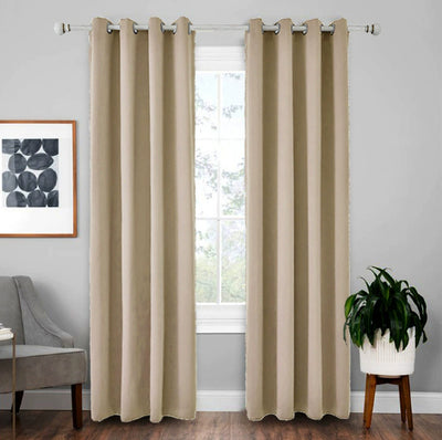 Light gray polyester blackout curtains with grommet tops hanging on a white rod in a modern living room. - Image 16
