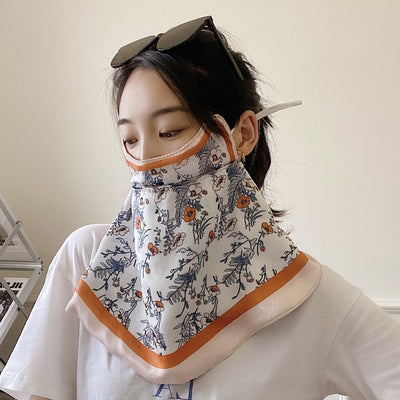 Female cream and black floral polka dot sun protection mask with ear loops, designed for eye corner protection. - Image 42