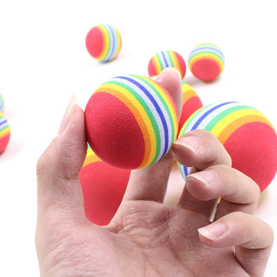 Set of three red pet play balls with rainbow stripes in varying sizes, made from soft EVA material. - Image 6