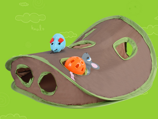 Brown and green cat play tunnel with nine holes, featuring a blue plush mouse and an orange ball with a bell. - Image 9