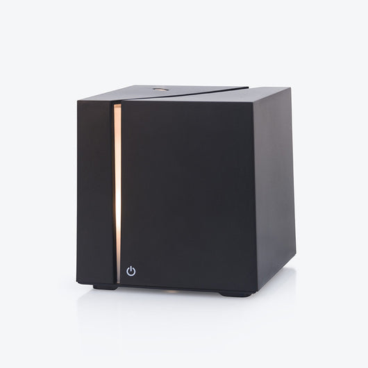 White and grey marble pattern ultrasonic aromatherapy diffuser with a vertical gold LED light strip and power button. - Image 4