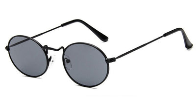Retro round sunglasses with pink lenses and a gold-colored metal frame, featuring black ear tips. - Image 5