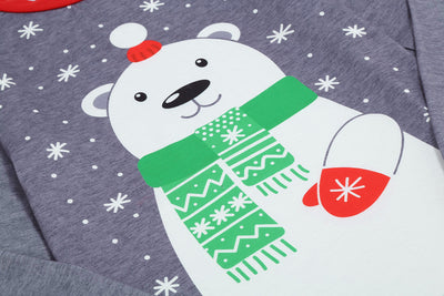 Family of five wearing matching gray and red buffalo plaid Christmas pajamas with polar bear print. - Image 13
