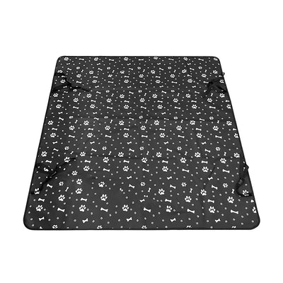 Pink car pet mat with white paw print and bone patterns, featuring black straps for securing to a rear seat. - Image 9