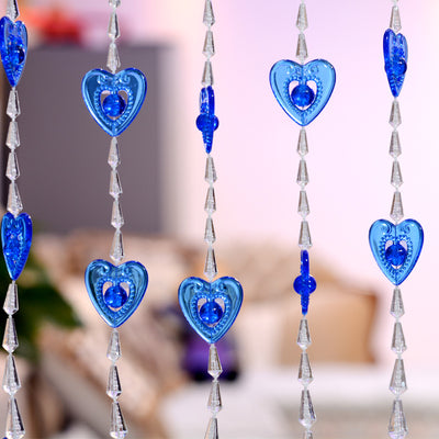 Close-up of a decorative door curtain with alternating red heart-shaped beads and clear faceted acrylic beads. - Image 5