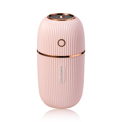 Navy blue portable humidifier with a ribbed texture, silver accents, and a power button on a white background. - Image 14