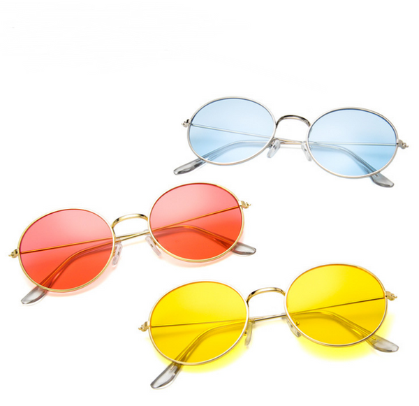 Round clear lens glasses with silver metal frames and black temple tips, shown from an angled and front view.
