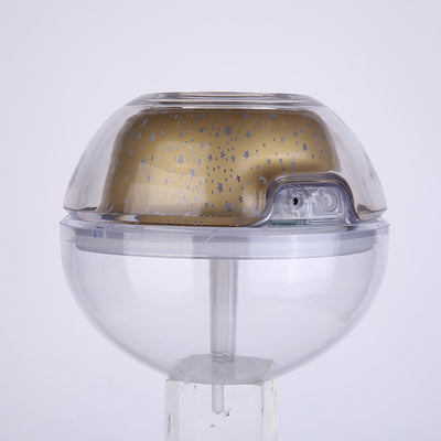 Silver and clear spherical essential oil diffuser with a starry night LED projector, featuring moon and star patterns. - Image 10