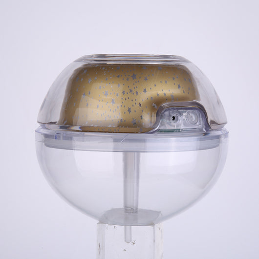 Silver and clear spherical essential oil diffuser with a starry night LED projector, featuring moon and star patterns. - Image 10