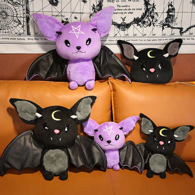 Black bat plush toy with grey ears and belly, pink nose, white fangs, and a yellow crescent moon. - Image 3