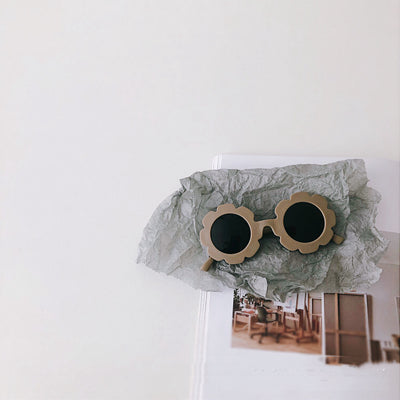 Orange flower-shaped sunglasses for babies and toddlers with dark lenses and a plastic frame. - Image 7