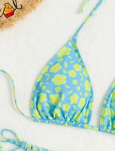 Lace-up sexy bikini with light blue and yellow floral print, featuring a triangle top and string tie bottoms. - Image 11